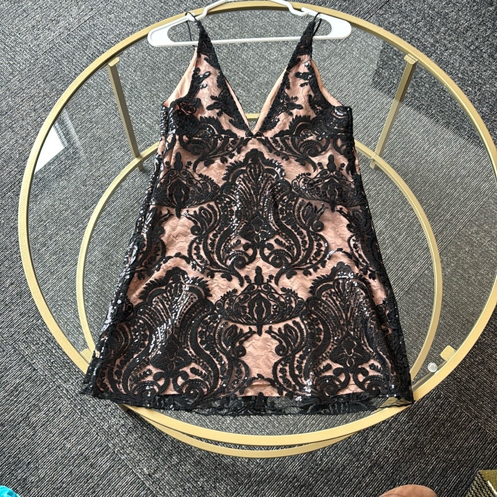 Brand new sequence, free people dress never been worn still has the tag on it.